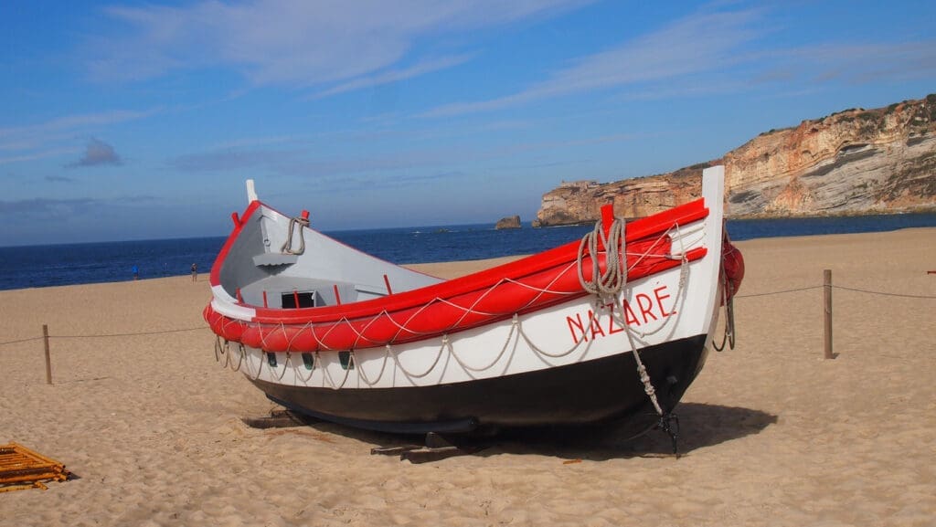 traditional fishing boat nazare portugal beach