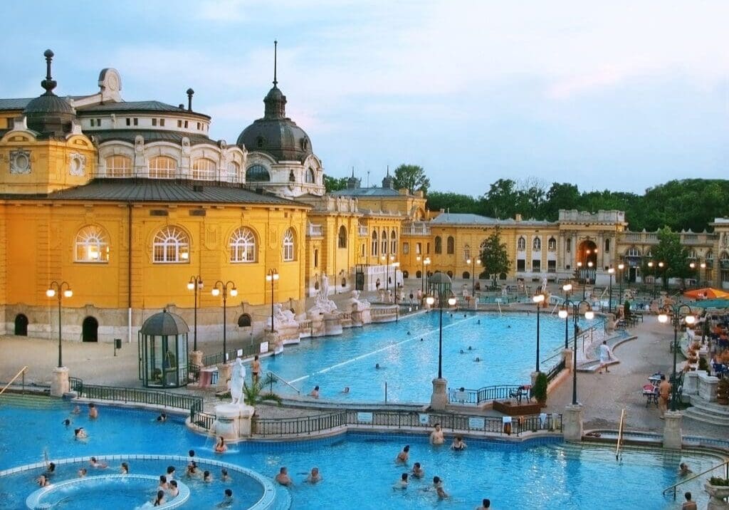 Széchenyi Thermal Bath outdoor pools and historic yellow spa building in Budapest, Hungary