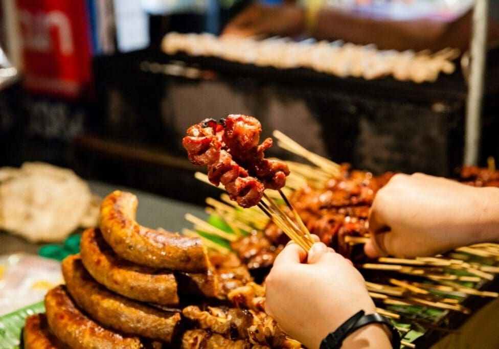 Thai street food skewers at the Thai market at the Buddhist Temple of Dallas